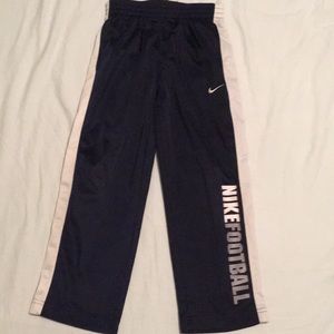 Size 5 Nike Football warm up pants, navy blue.